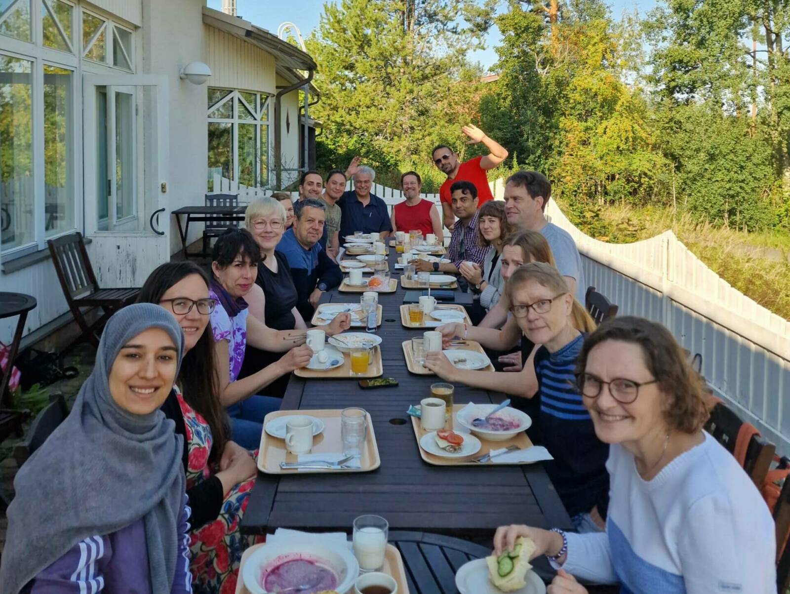 People sitting by a breakfast table.