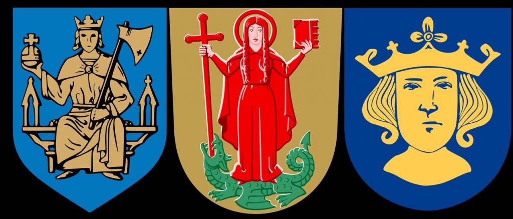 Tre kommunvapen Jomala kommunvapen med Sankt Olof i guldfärg mot blå botten. Vemos kommunvapen med Sankta Margareta i röda kläder ståendes på en grön drake mot en guldfärgad bakgrund. Stockholms kommunvapen med bysten av Sankt Erik i gult mot blå botten.