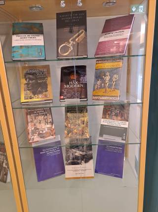 Picture of a book vitrine showcasing Trivium's recent publications