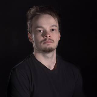 A portrait photo against black background.