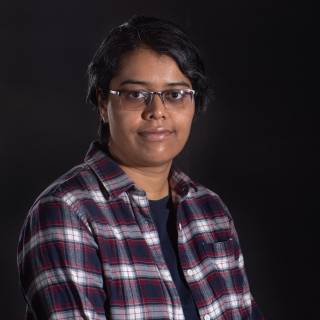 A portrait photo against black background.