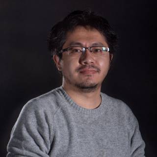 A portrait photo against black background.