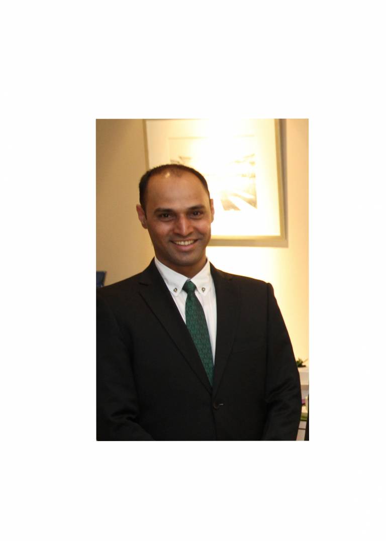 Sagar Bhalerao, asian male in a black suit