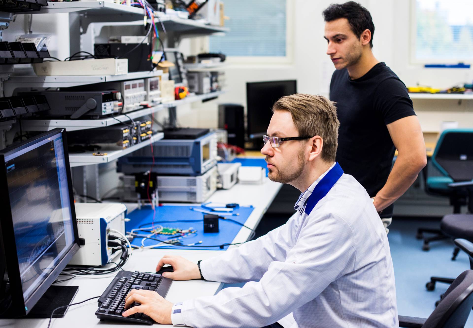 Researchers in RF lab