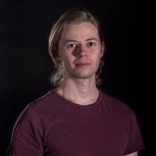 A portrait photo against black background.