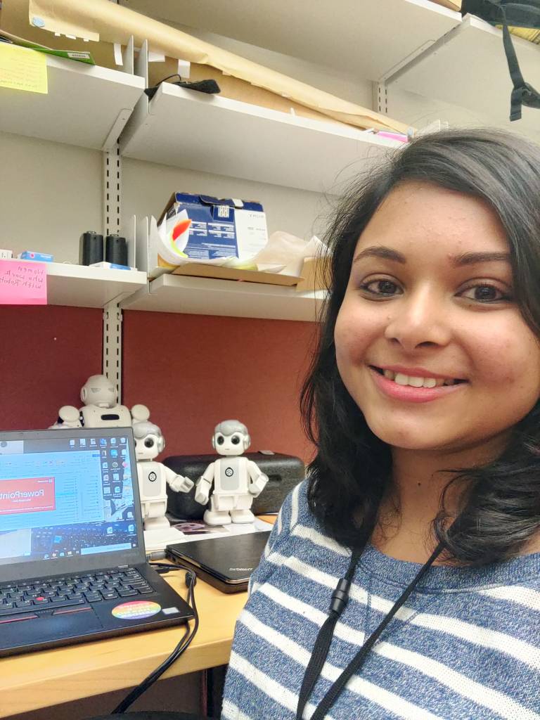 TAU Researcher with a robot
