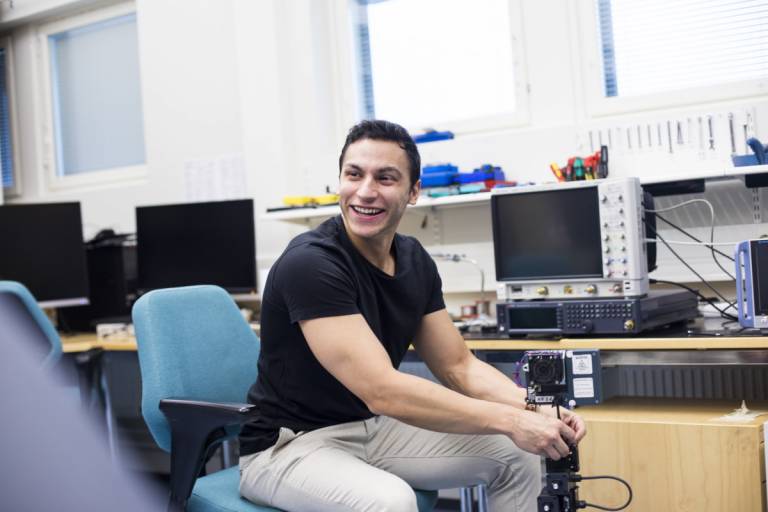 Pablo Pascual Campo sitting on a chair at the RF laboratory