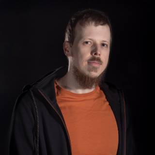 A portrait photo against black background.