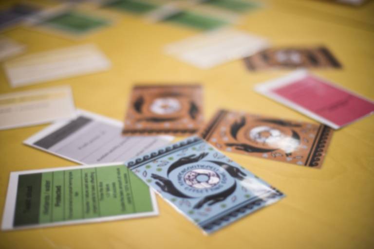 Several cards in various colours scattered on a table