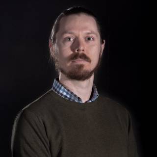 A portrait photo against black background.