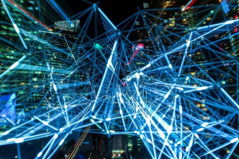Abstract picture of night time city with many lines that are interconnected.