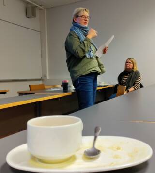 Picture of Sanna Turoma and Katja Lehtisaari with a coffee cup in the foreground.