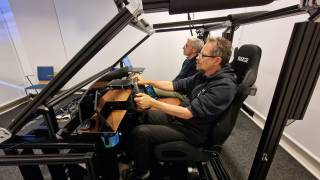 Two people in a driving lab environment