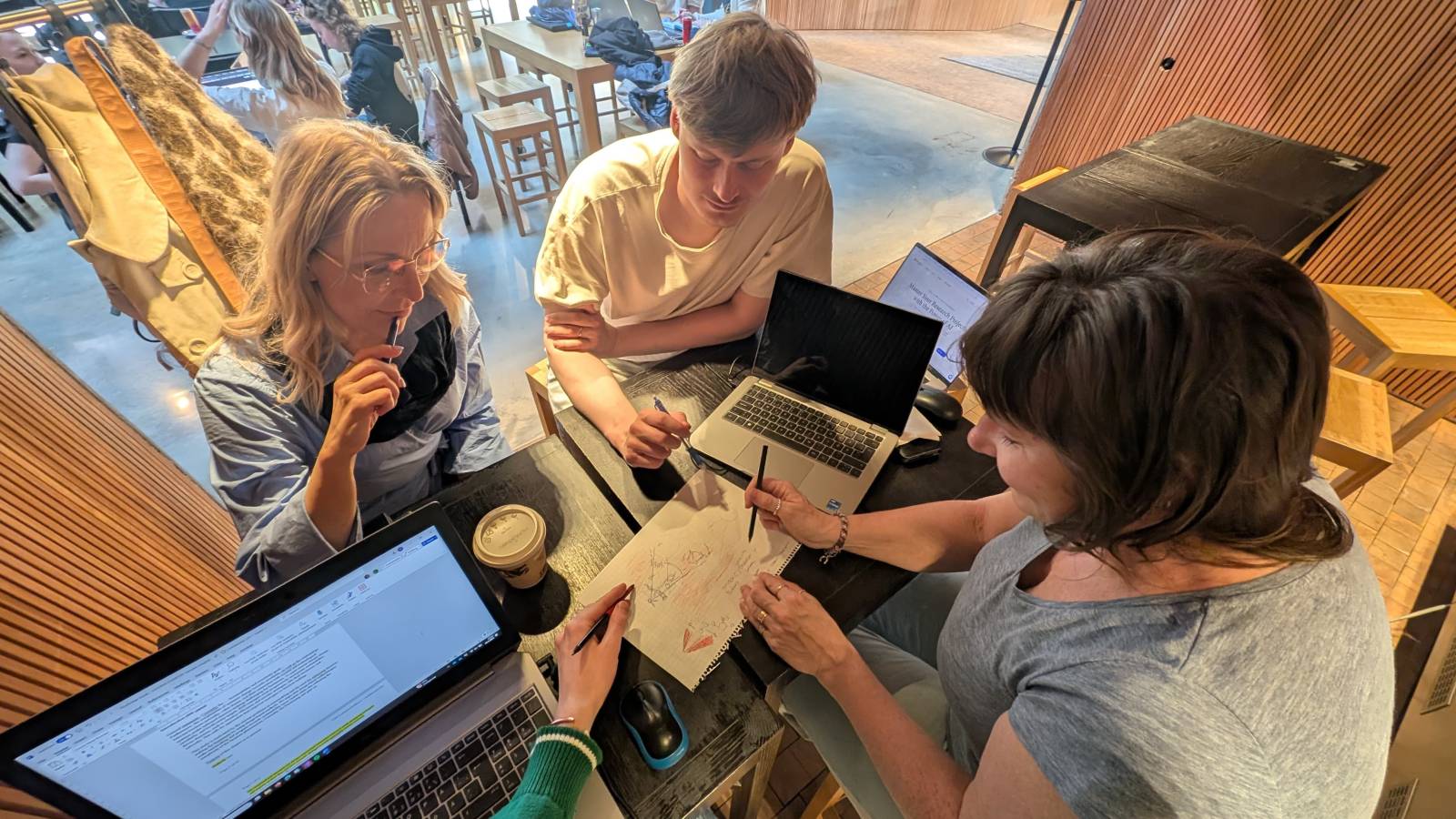 People working together around a coffee table.