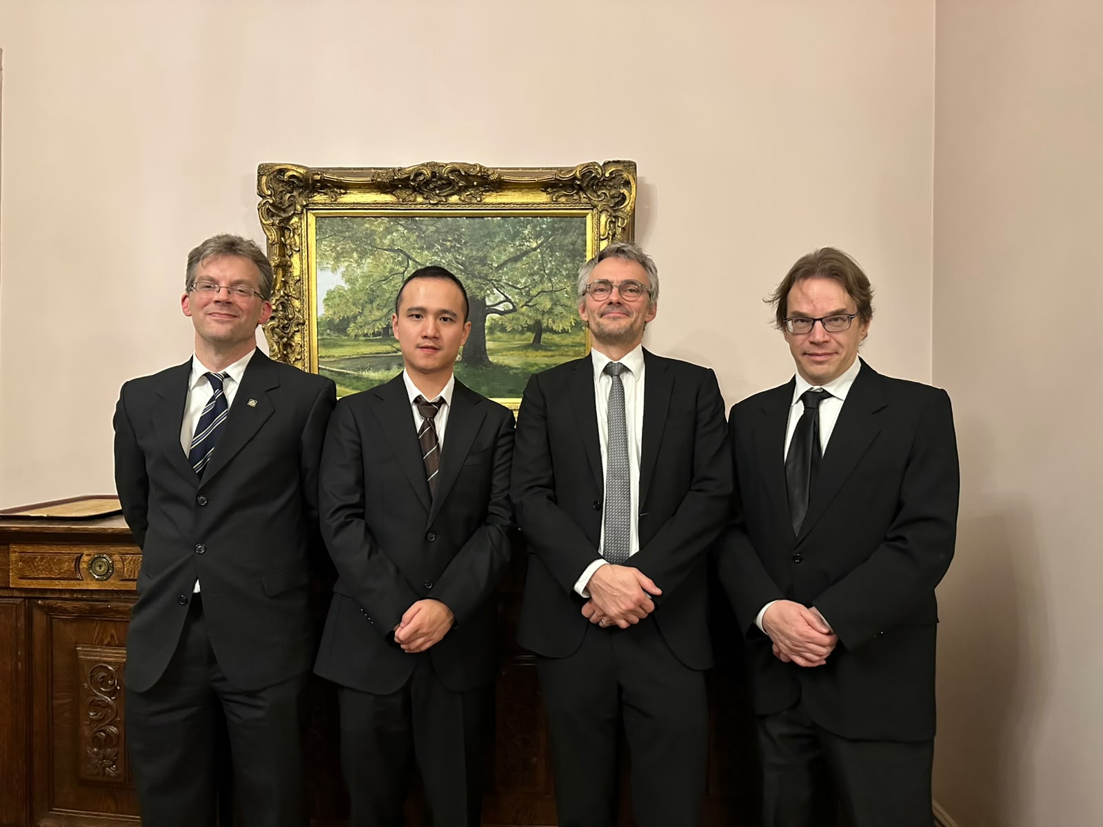 Professor Christian Smith (opponent, KTH Royal Institute of Technology), Wenyan Yang, Professor Joni Kämäräinen (supervisor) and Professor Ville Hautamäki (opponent, Uni Eastern Finland)