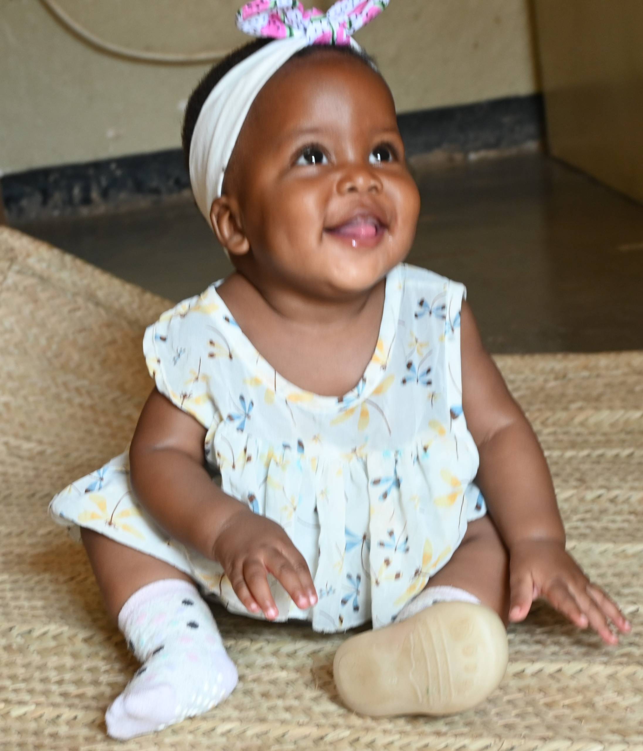 Baby girl sitting on the floor