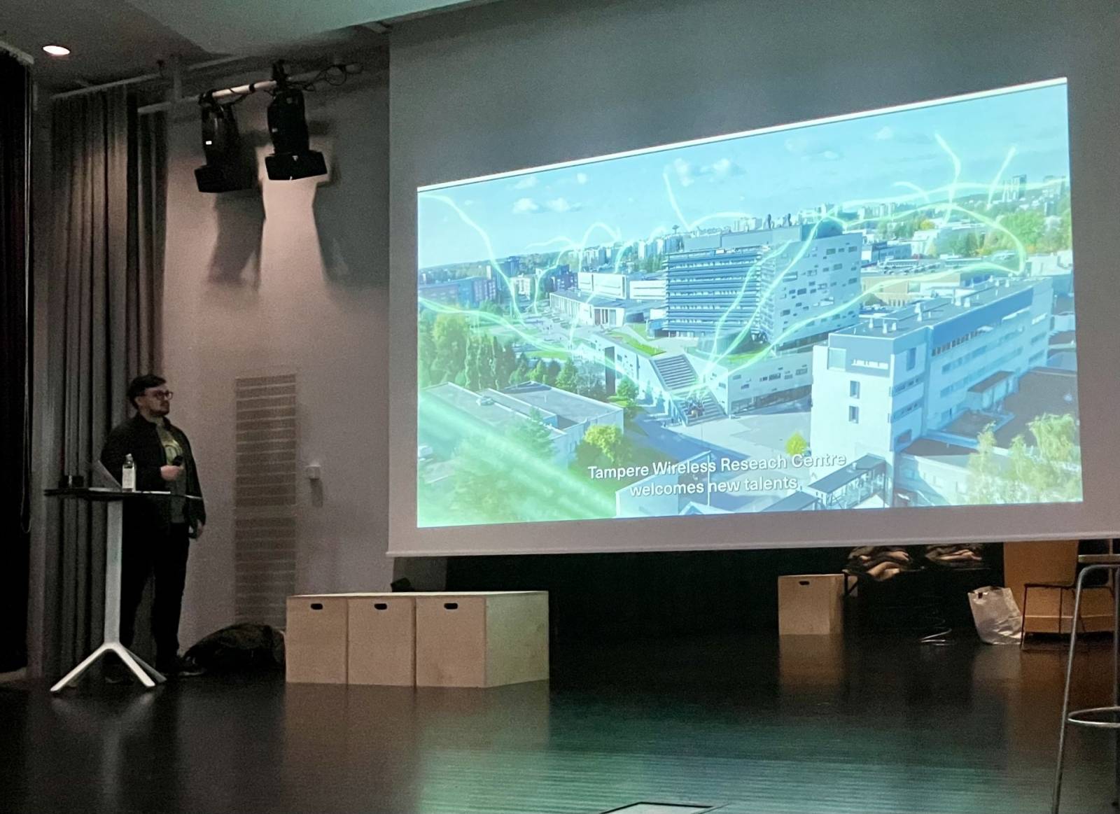 Picture of Aleksandr Ometov presenting TWRC.