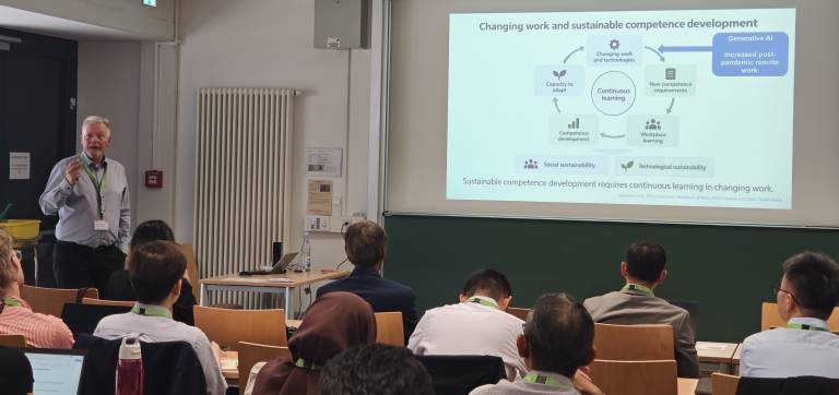 Petri Nokelainen presenting workplace learning research at UNESCO Chair Conference 2026.