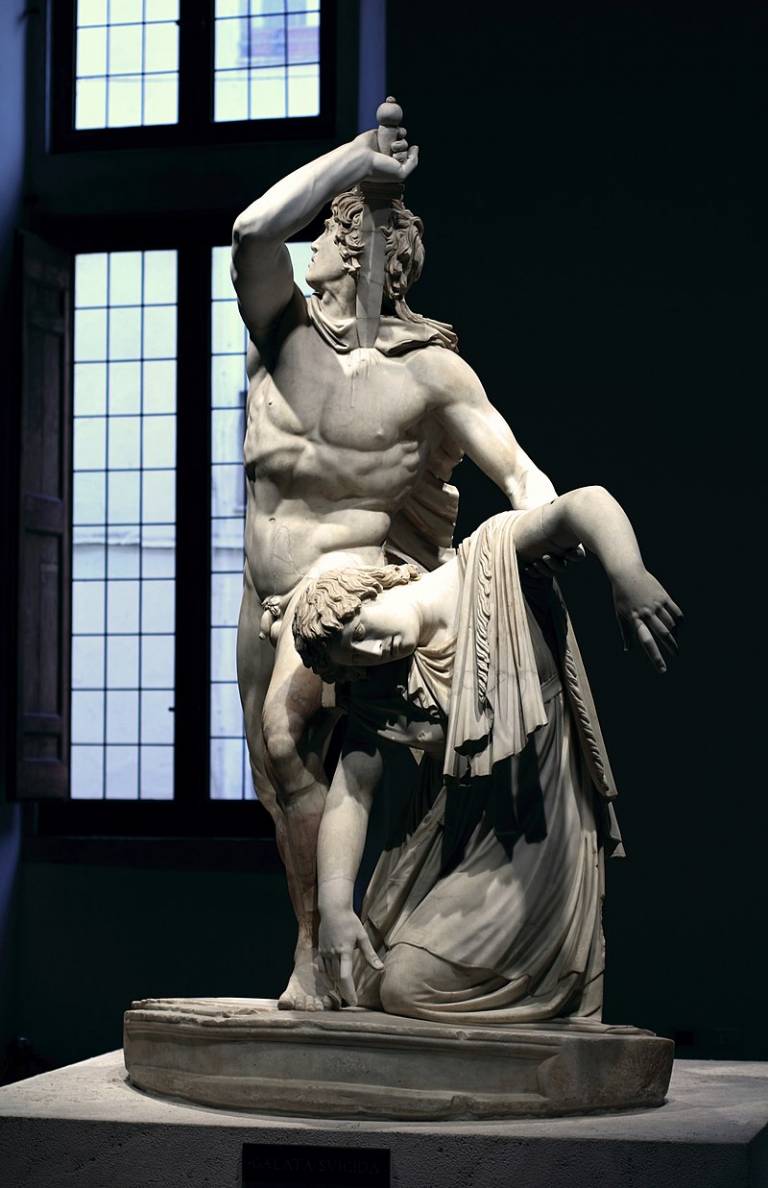 Ancient Roman statue depicting a Gallic man plunging a sword into his breast as he holds up the dying body of his wife.