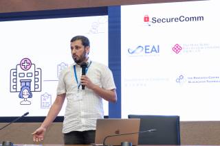 Presentation of the paper "Split Without a Leak: Reducing Privacy Leakage in Split Learning" from Tanveer Khan at SecureComm 2023