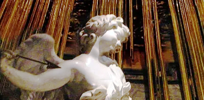 Upper part of a sculpture of an angel holding a spear